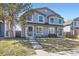 Charming two-story home with a well-manicured lawn and inviting entrance at 2163 S Grant St, Denver, CO 80210