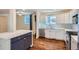 Bright kitchen featuring custom cabinets, marble countertops, and modern appliances at 2163 S Grant St, Denver, CO 80210