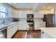 Well-appointed kitchen boasts modern appliances, ample counter space, and stylish finishes for easy cooking at 2163 S Grant St, Denver, CO 80210