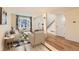 Inviting living room with hardwood floors, comfortable seating, and large window showcasing the exterior view at 2163 S Grant St, Denver, CO 80210