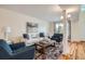 Cozy living room featuring a comfortable sofa, stylish armchairs, and a colorful rug at 2163 S Grant St, Denver, CO 80210