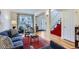 Bright living room boasts hardwood floors, large windows, and stylish decor with comfortable seating at 2163 S Grant St, Denver, CO 80210