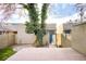 Inviting backyard with a wooden deck, a charming tree covered in vines, and a modern home at 2659 S Cherokee St, Denver, CO 80223