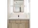 Modern bathroom featuring a stylish vanity, with bright lighting and a glass-enclosed shower at 2659 S Cherokee St, Denver, CO 80223