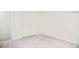 Bright, carpeted bedroom featuring a closet and a clean, minimalist design at 2659 S Cherokee St, Denver, CO 80223