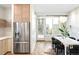 Contemporary dining area with stainless steel appliances and a view of the outdoors at 2659 S Cherokee St, Denver, CO 80223