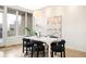 Contemporary dining area with unique lighting and decorative rug detail at 2659 S Cherokee St, Denver, CO 80223
