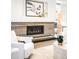 Elegant fireplace with decorative tile surround and modern design elements at 2659 S Cherokee St, Denver, CO 80223