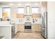 Modern kitchen featuring stainless steel appliances, sleek cabinetry, and ample natural light at 2659 S Cherokee St, Denver, CO 80223