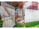Fenced backyard features wooden playhouse and access to back entrance at 1172 S Zeno Way # F, Aurora, CO 80017