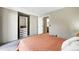 Bedroom features a mirrored closet with built in storage at 1172 S Zeno Way # F, Aurora, CO 80017