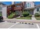 Inviting townhouse with brick accents, a cozy balcony, and convenient parking at 1172 S Zeno Way # F, Aurora, CO 80017