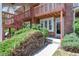 Charming brick townhouse with wood stairs and a covered balcony entrance at 1172 S Zeno Way # F, Aurora, CO 80017