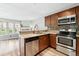 Updated kitchen with stainless steel appliances and modern tile backsplash at 1172 S Zeno Way # F, Aurora, CO 80017