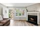 Bright, open living area with a front entry view and fireplace feature at 1172 S Zeno Way # F, Aurora, CO 80017