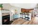 Bright living space with a cozy fireplace, stylish decor, and kitchen breakfast bar at 1172 S Zeno Way # F, Aurora, CO 80017