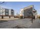 Outdoor basketball court and parking area, surrounded by modern townhome exteriors at 4517 Tabor St, Wheat Ridge, CO 80033