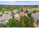 Beautiful aerial view of the home with a deck and mature trees and surrounding neighborhood at 6542 S Tempe St, Aurora, CO 80016