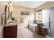 Bright bathroom features double sinks, separate tub, and a walk-in shower at 6542 S Tempe St, Aurora, CO 80016