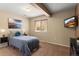 Cozy bedroom with a comfortable queen bed, soft lighting, and neutral tones at 6542 S Tempe St, Aurora, CO 80016