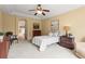 Cozy bedroom featuring a comfortable bed, dresser, and stylish decor at 6542 S Tempe St, Aurora, CO 80016