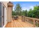 Spacious wood deck with stone pillars and outdoor dining furniture, perfect for entertaining at 6542 S Tempe St, Aurora, CO 80016