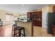 Spacious kitchen with granite countertops, cherry cabinets, and stainless steel appliances at 6542 S Tempe St, Aurora, CO 80016