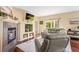 Inviting living room with a fireplace, mounted TV, and sliding door to backyard at 6542 S Tempe St, Aurora, CO 80016
