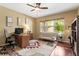 Bright home office with a large window, hardwood floors, and neutral decor at 6542 S Tempe St, Aurora, CO 80016