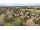 An aerial view of the home and neighborhood showcasing the lush greenery and community at 8072 Windwood Way, Parker, CO 80134