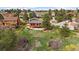 Aerial view of a home featuring a fenced yard and treed surroundings at 8072 Windwood Way, Parker, CO 80134
