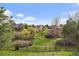 A beautiful backyard with a fence and lush greenery surrounding the property at 8072 Windwood Way, Parker, CO 80134
