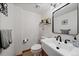 Well-lit half bathroom featuring modern fixtures, vanity, and decorative accents at 8072 Windwood Way, Parker, CO 80134