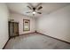 Bright bedroom features a ceiling fan, window, and minimalist decor at 8072 Windwood Way, Parker, CO 80134