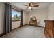 Bright bedroom with neutral carpet, natural light, and furnishings at 8072 Windwood Way, Parker, CO 80134