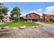 Two-story home features a well-maintained lawn and a long driveway at 8072 Windwood Way, Parker, CO 80134