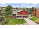 Aerial view of a two story home with beautiful landscaping and a large front yard at 8072 Windwood Way, Parker, CO 80134