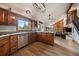 Spacious kitchen features wooden cabinets, stainless steel appliances, and granite countertops at 8072 Windwood Way, Parker, CO 80134