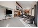 Bright living room showcasing open layout, wet bar, fireplace, and comfortable seating at 8072 Windwood Way, Parker, CO 80134