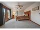 Bright bedroom with an exterior door that leads to a balcony overlooking the neighborhood at 8072 Windwood Way, Parker, CO 80134