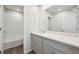Bathroom featuring bright vanity, quartz countertops, and a shower/tub combo at 2169 Flower Blossom Ave, Brighton, CO 80601