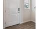 Close up of the front door showing the lock and the interior entryway at 2169 Flower Blossom Ave, Brighton, CO 80601