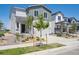 Attractive gray and white two-story home with a two-car garage, landscaped front yard, and covered entrance at 2169 Flower Blossom Ave, Brighton, CO 80601