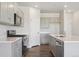 Modern kitchen featuring stainless steel appliances, gray cabinets, and a spacious countertop at 2169 Flower Blossom Ave, Brighton, CO 80601