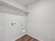 Laundry room with hookups and a shelf at 2169 Flower Blossom Ave, Brighton, CO 80601