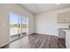 Bright living room featuring a glass sliding door and contemporary design at 2169 Flower Blossom Ave, Brighton, CO 80601