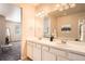 Spacious bathroom with dual sinks, ample counter space, and a large mirror at 6777 S Old Hammer Ct, Aurora, CO 80016