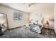 Cozy bedroom with soft lighting, a comfortable bed, and neutral tones creating a relaxing atmosphere at 6777 S Old Hammer Ct, Aurora, CO 80016