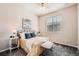 Serene bedroom with ample natural light, neutral decor, and comfortable furnishings at 6777 S Old Hammer Ct, Aurora, CO 80016
