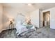 Well-lit bedroom with plush carpeting, inviting bed, and door for easy access to the hallway at 6777 S Old Hammer Ct, Aurora, CO 80016